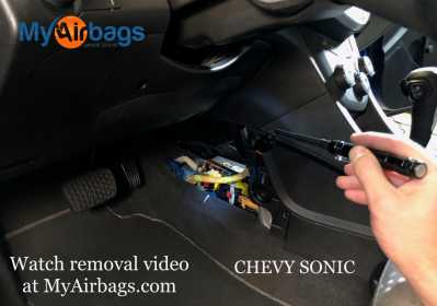 LOCATION CHEVY CHEVROLET SONIC 2015 2016 2017 2018 2019 AIRBAG SDM DERM AIRBAG CONTROL MODULE COMPUTER REMOVAL REMOVE INSTALL CENTER CONSOLE